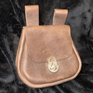 Brown Leather Backpack with Classic Design and Flap Closure